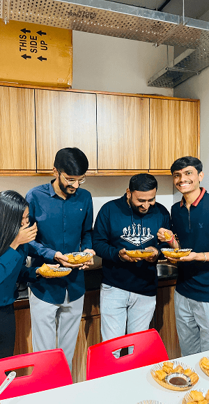 Vivansh Infotech team sharing food at the office